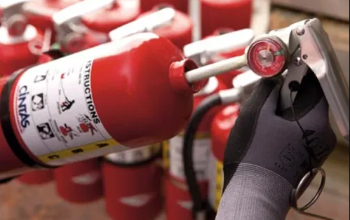 Fire extinguisher being inspected